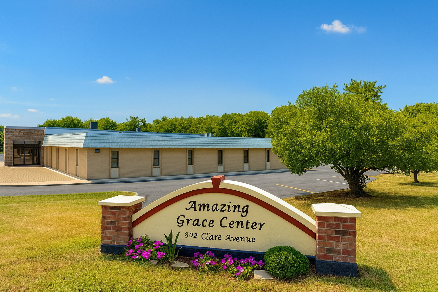 Single-story tan brick building with an Amazing Grace Center sign reading 802 Clare Avenue