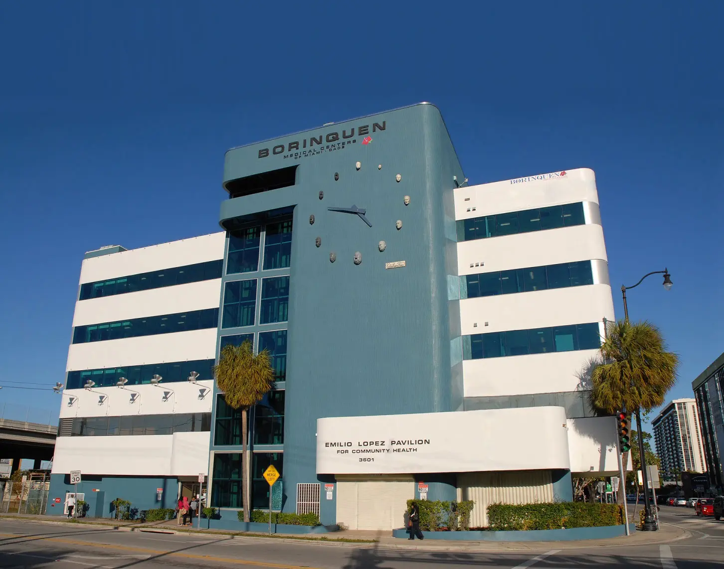 Multi-story blue and white Borinquen Medical Centers building with Borinquen signage on its facade