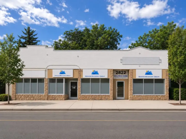 Brick and stone storefront with Denver Recovery Group signs and address 2822