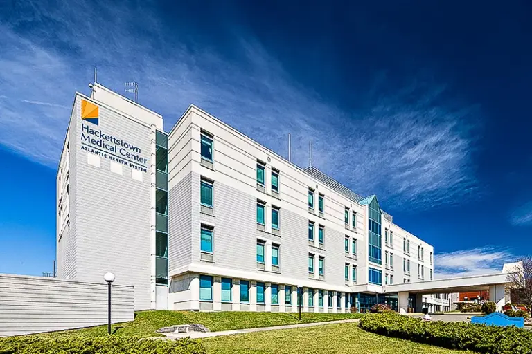 Multi-story hospital building with Hackettstown Medical Center sign on the facade and a covered entrance drive