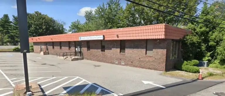 One-story brick building with a red tile roof and a Health Care Resource Centers sign at the entrance