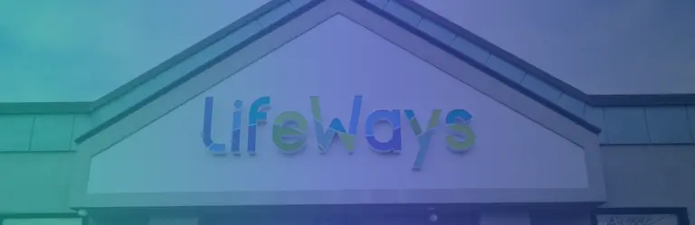Two-story building with a LifeWays sign on the gabled front