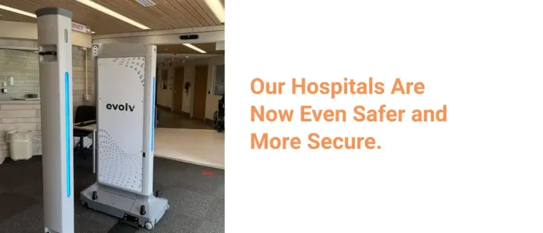 Hospital lobby with an evolv security scanner near an emergency department sign