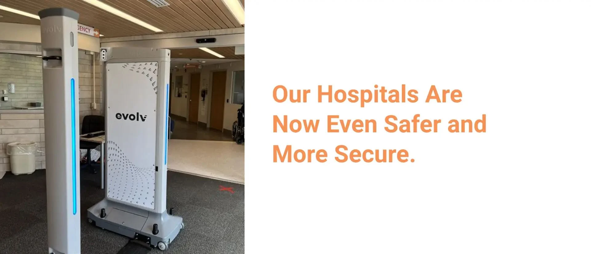 Hospital lobby with an evolv security scanner near an emergency department sign
