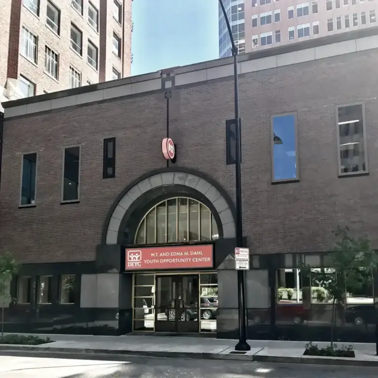 Brick building with arched entrance and a sign reading W.T. and Edna M. Dahl Youth Opportunity Center